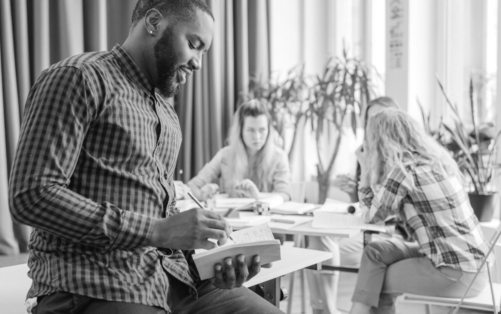 Professional reviewing financial documents and charts in a modern office setting